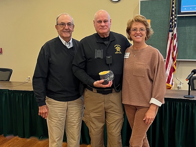 Pictured L/R: Rotarian Cal Ewing, Deputy Ron Kesner, Deanne Marshall (President)